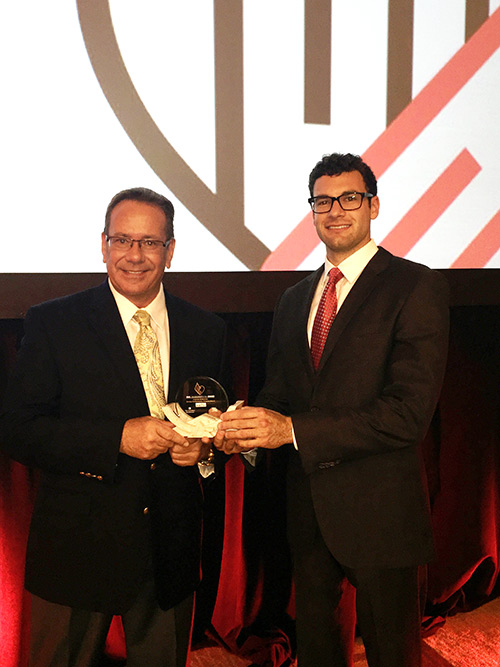 Greg Nett and Albert Covelli holding the award